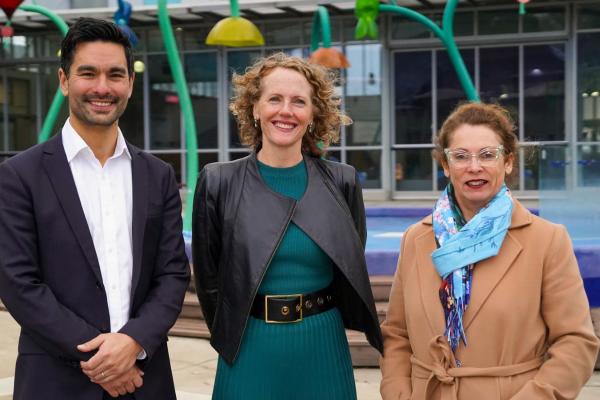 Federal Member for Menzies Gabriel Ng, Manningham Mayor Cr Deirdre Diamante, North-Eastern Metropolitan MP Sonja Terpstra standing in front of the children's outdoor pool.
