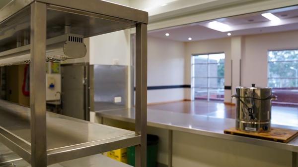 photo of the kitchen at the Ajani centre with urn and shelving