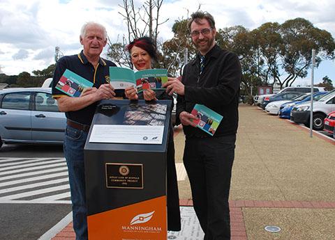 Photo of people standing at the Tunstal Square Rotary Walk with the new booklet