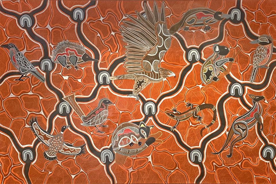 Coming Together by First Nation's artist Ash Firebrace - native animals sit on top of thick black lines that crisscross across a bright orange background 