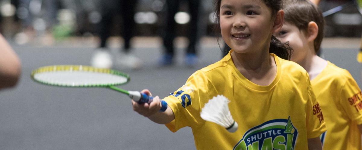 A girl play badminton