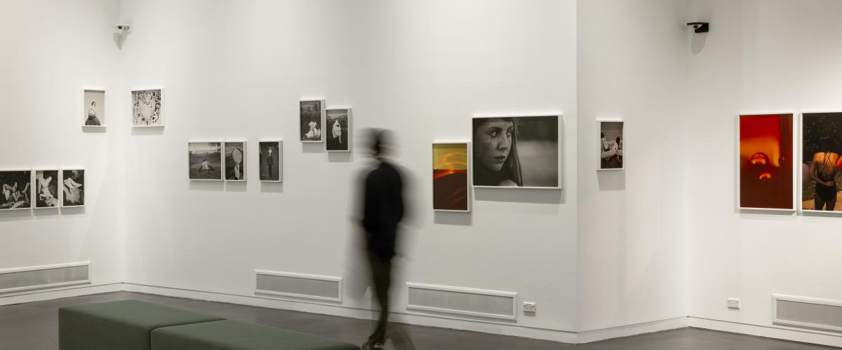 An interior photograph of Manningham Art Gallery showing photographs by Katrin Koenning on the walls.