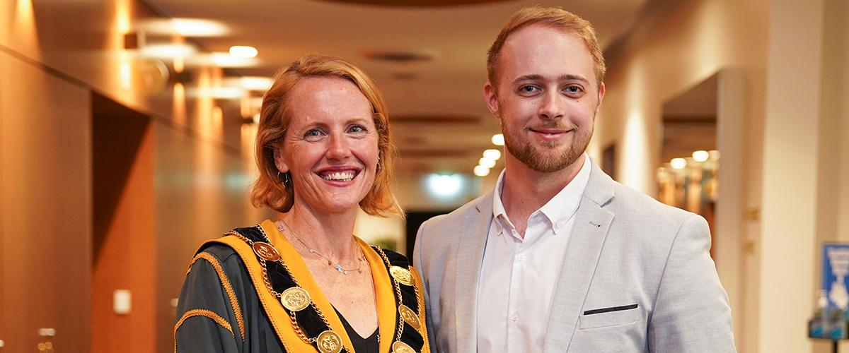 Portrait photo of Cr Deirdre Diamante in robes with Deputy Mayor Cr Tomas Lightbody