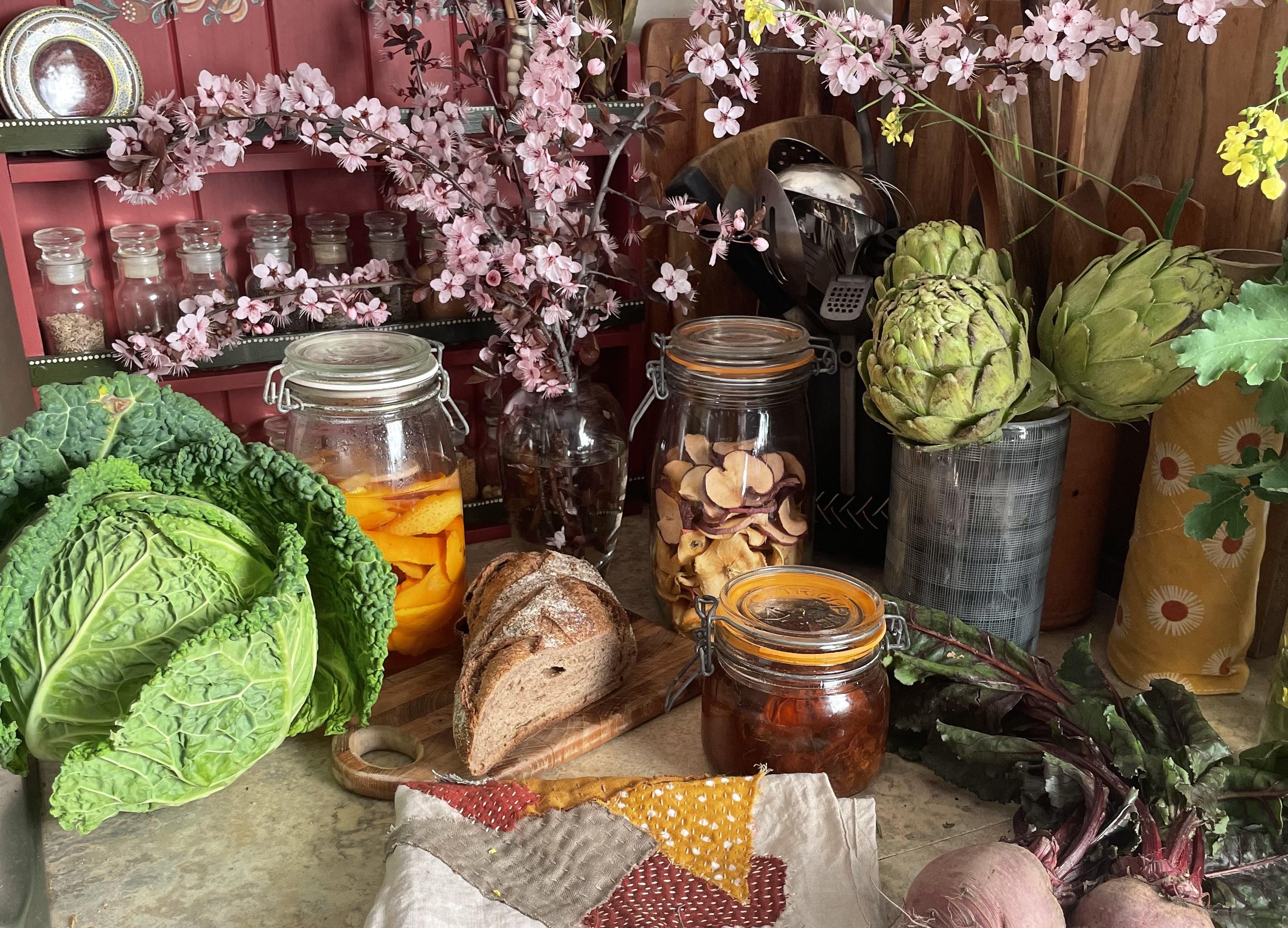 Image of prop items for a low waste presentation including storing jars, upcycled fabric towels and dried herbs 