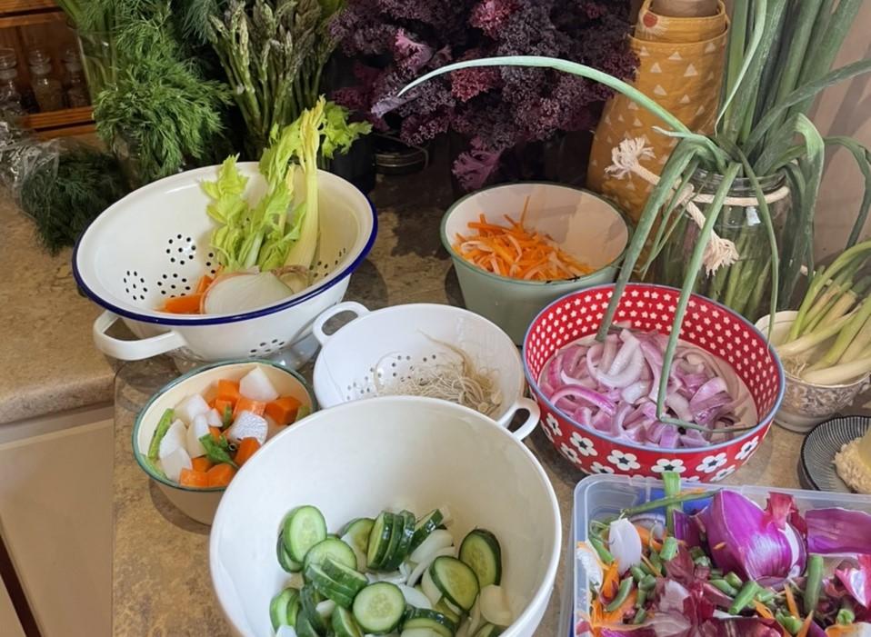 Image of bowls of cut food and fresh produce