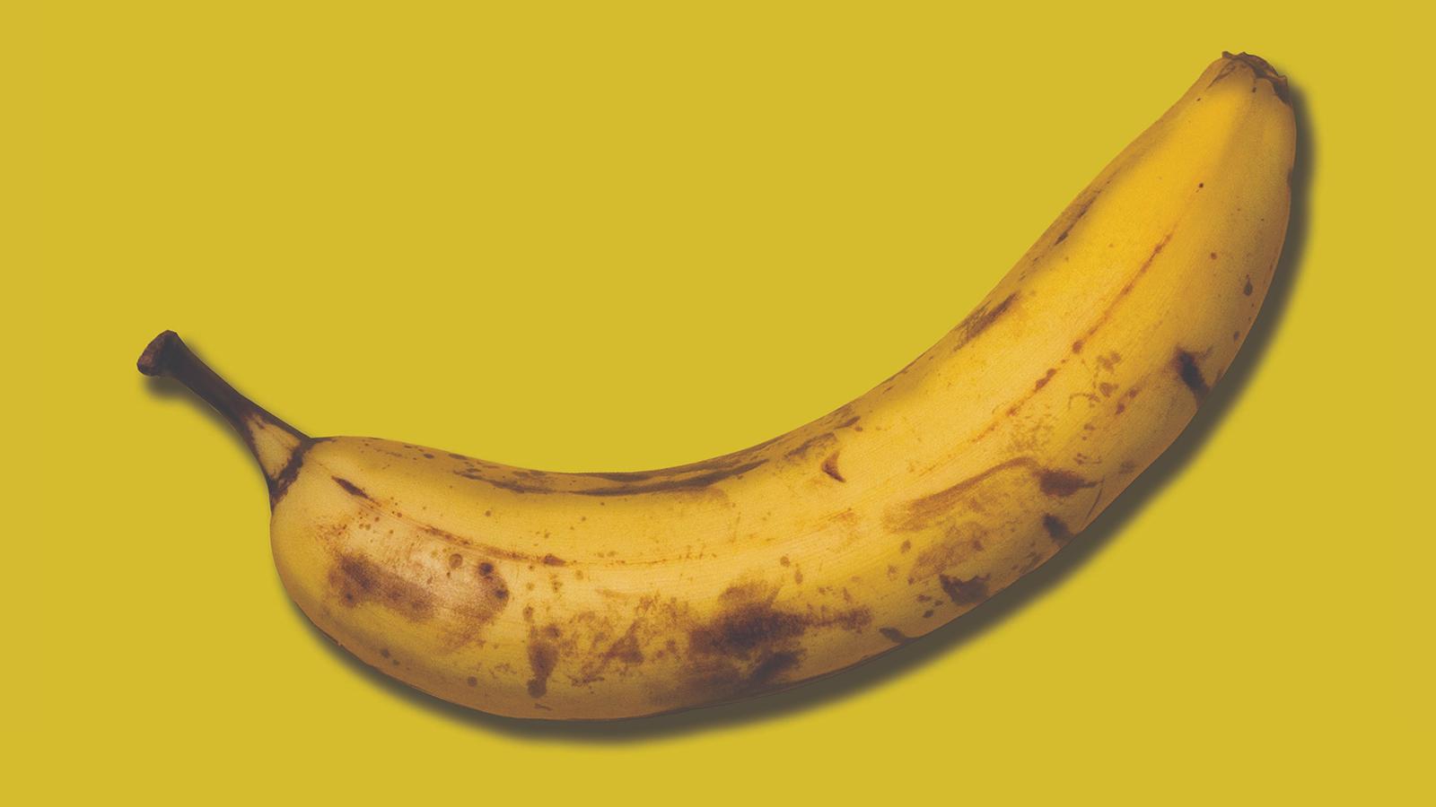 An old banana on a yellow background