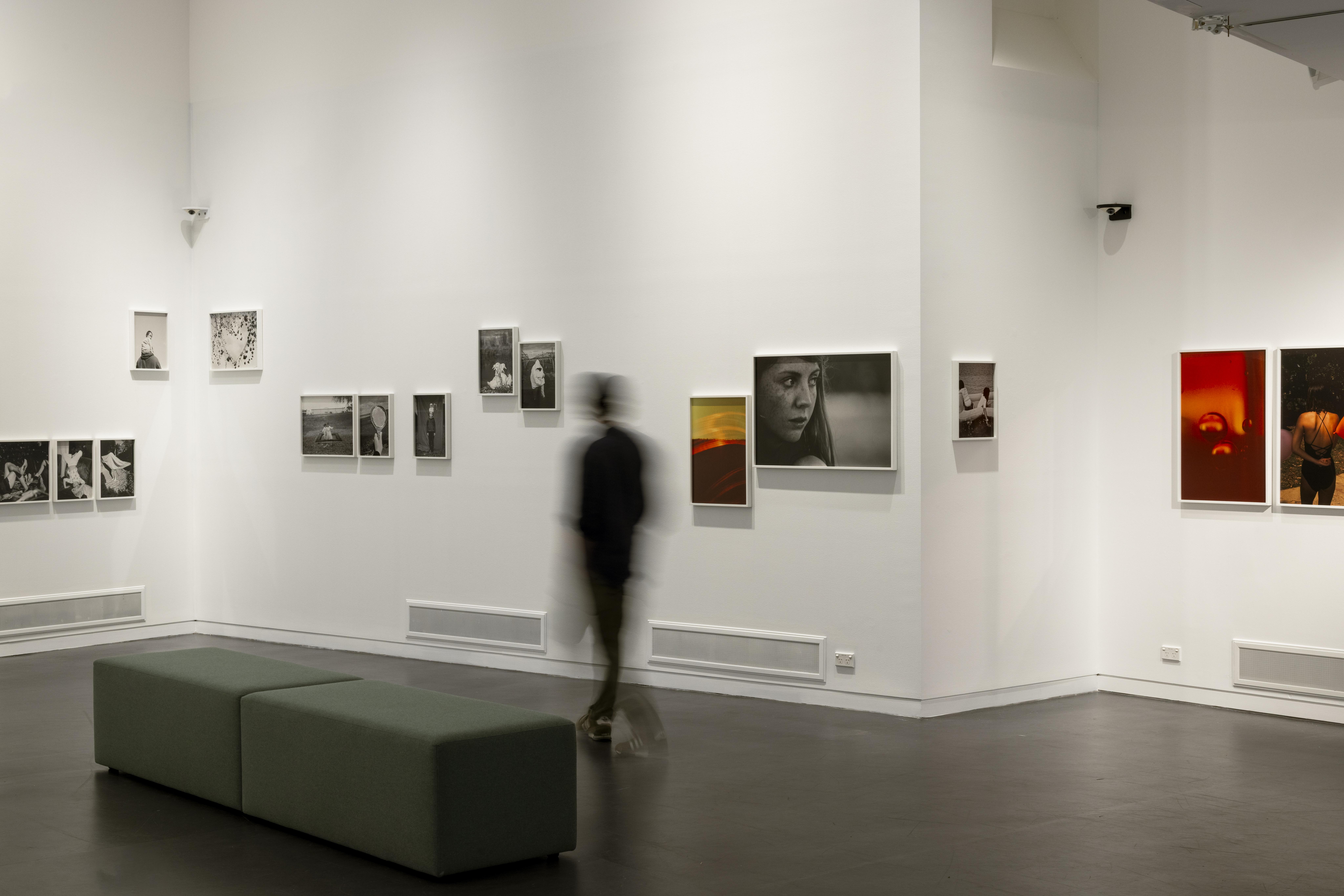 An interior photograph of Manningham Art Gallery showing photographs by Katrin Koenning on the walls.