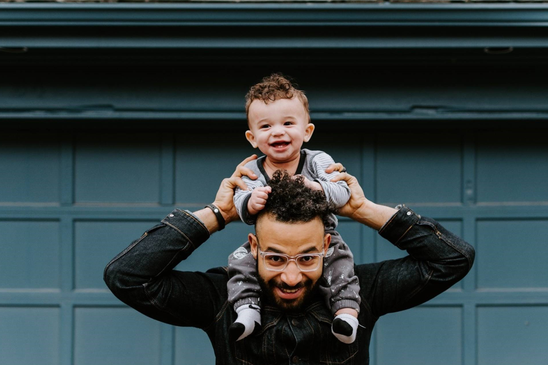 Man holding toddler