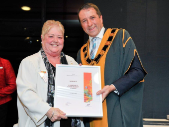 the late Doreen Stoves and former Mayor Andrew Conlon holding award