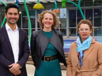 Federal Member for Menzies Gabriel Ng, Manningham Mayor Cr Deirdre Diamante, North-Eastern Metropolitan MP Sonja Terpstra standing in front of the children's outdoor pool.