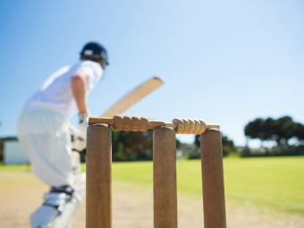 Cricket player behind stumps