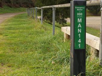 Emergency markers on park footpath