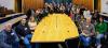 Photo of a group of people around the Council Chamber table