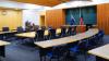 photo inside the council chamber showing the meeting table, the visitor gallery, lectern and both Australian and Aboriginal and Torres Straight Islander flags